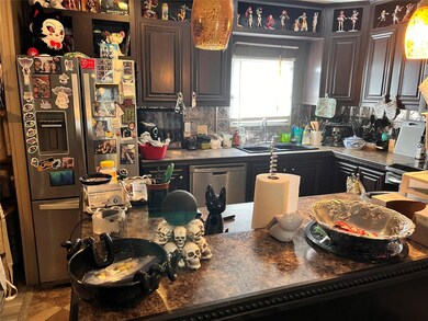Kitchen featuring appliances with stainless steel