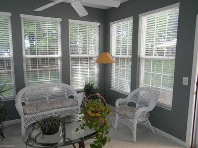 Sun Room.  This lovely sunroom has a ceiling fan and leads to the patio.