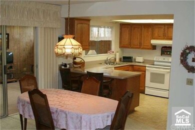 Lovely kitchen with corian counter and cozy breakf