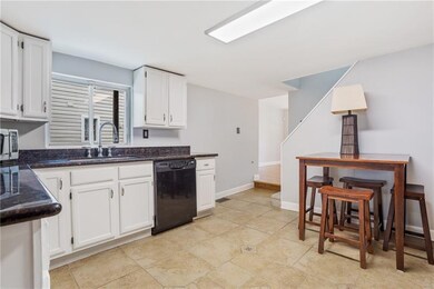 Kitchen with view into living room