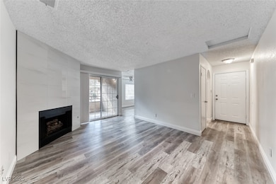 Living room w/ceiling fan & light, w/luxury vinyl