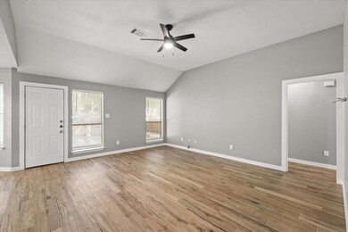 Unfurnished living room with visible vents, lofted