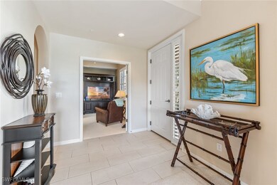 Entrance foyer featuring recessed lighting and bas