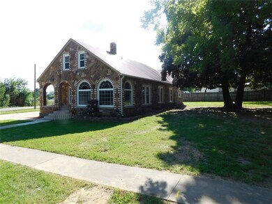 It is definitely a stately home with a huge magnolia tree in the yard (with a double trunk).