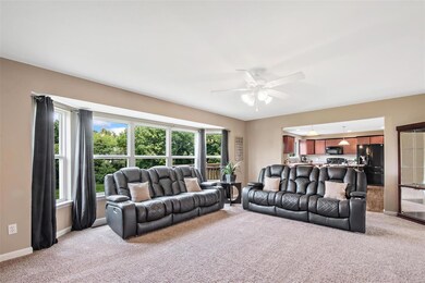 Living room opens to breakfast room and kitchen.