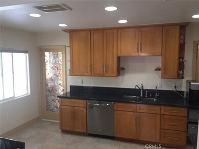 Kitchen: black pearl granite, 18 x 18 Italian ceramic tile, birch wood cabinets, recessed lighting