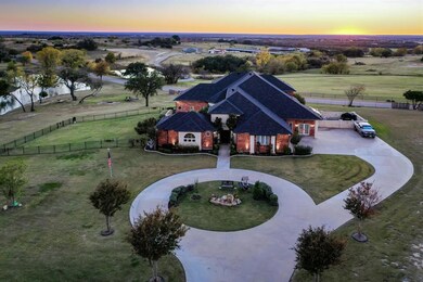127 Eagle View Court.  Circle drive, iron fenced yard, rolling hills and sunsets!