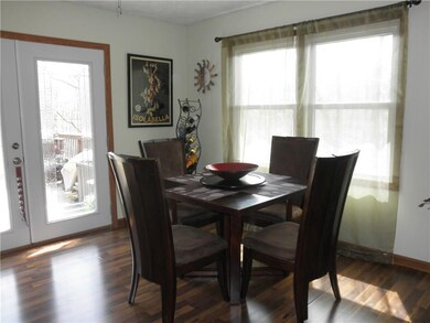 Plenty of dining space with new patio doors leading out to the deck.