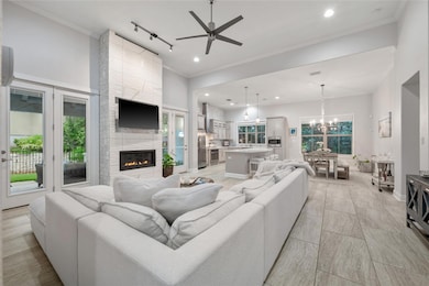 Living room featuring ceiling fan, recessed light