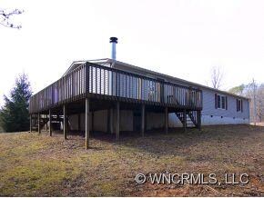 Rear of home with wrap around