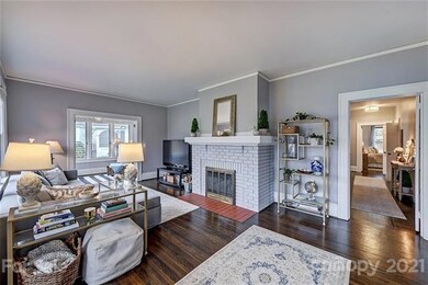 Living room with fireplace, leads to Sunroom/Offic