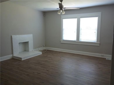 Open concept living room with luxury vinyl plank f