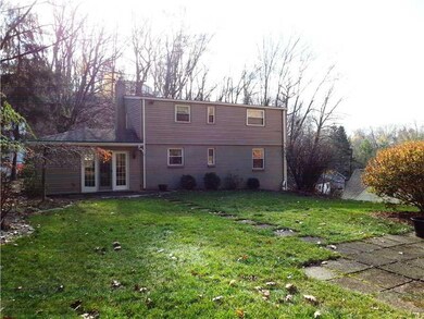 Exterior Front. Back of home. French doors to ston