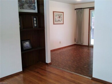 Built-in shelves in living room and view of the di