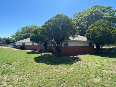 View of home's exterior with a yard