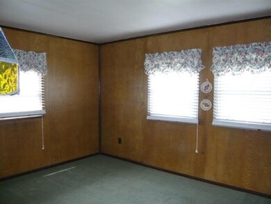 One of the two bedrooms with 3 windows for lots of