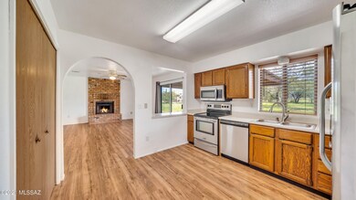 Kitchen with pass thru & Brick Fireplace