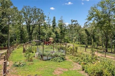 Raised Garden Beds and a Cedar Greenhouse.