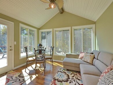 Sunroom adjacent to Kitchen and opens to deck.