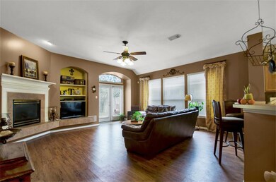 Built-in cabinet, gaslog  fireplace & amazing natural light!