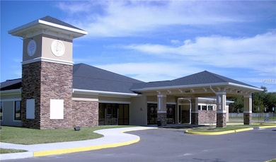 BUILDING IN FRONT OF THE COMMUNITY POOL.
