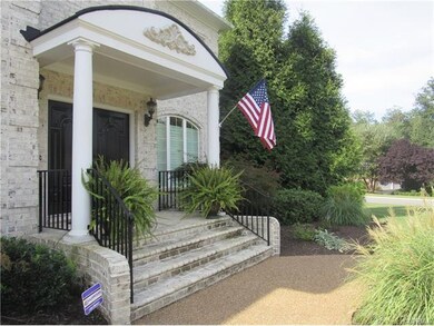 Elegant covered front entry with double doors and 