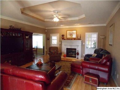 Great room with fireplace with gas logs and beauti