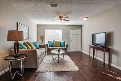 Rich looking hardwood floors flow through Living A