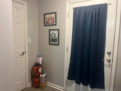 Foyer with storage closet at both ends