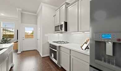 Stylish kitchen with quartz countertops and stainl