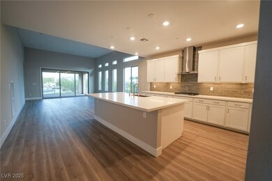 Kitchen featuring decorative backsplash, wood fini