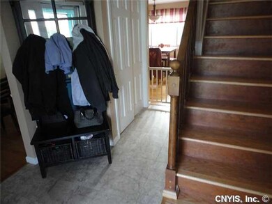 Foyer Marble tiled foyer with large coat closet