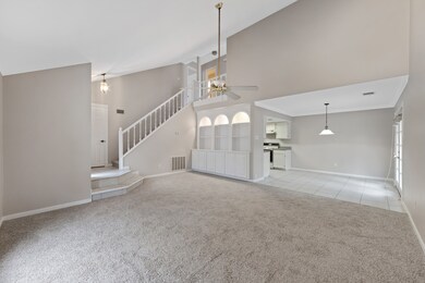 The family room is enhanced by built-in cabinets a