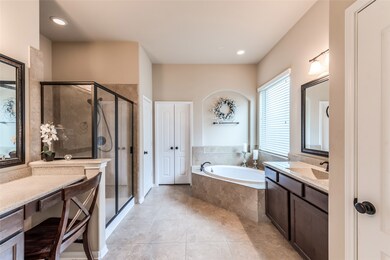 Master bath envy at its best! Separate vanities offer ample space to get ready in the mornings.