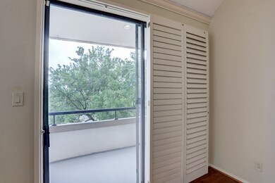 Sliding glass doors lead out to a large balcony of