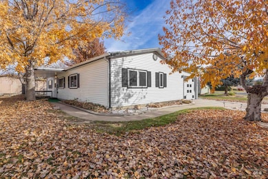 View of property exterior with concrete driveway