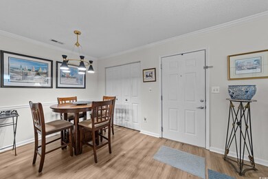 Dining space featuring light wood-type flooring, o