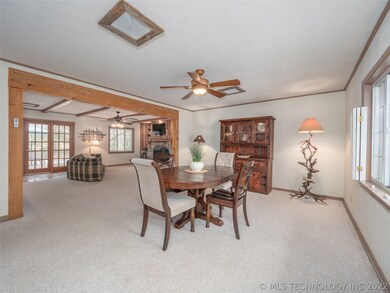Dining Room is open to the cozy hearth Family Room