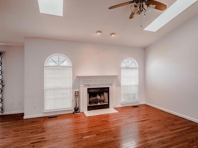 Light and bright vaulted great room with wood burn