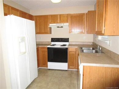 Kitchen area with Electric Range, Dishwasher, Disp