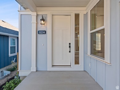 Doorway to property featuring board and batten siding