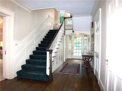 Foyer. Rear view of foyer with stairway to second 