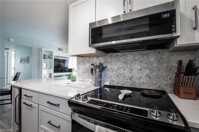 Kitchen featuring stainless steel appliances, whit