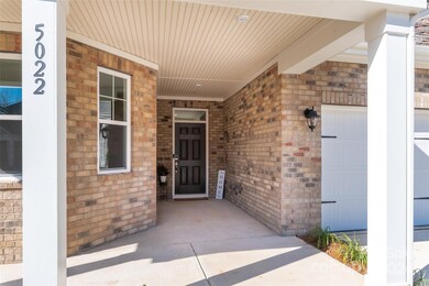 I love this feature - nice set back door means no concerns about your guests or packages getting rained on at the front door!