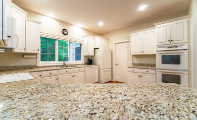 The door you see at the far end leads to the laundry/mud room area.