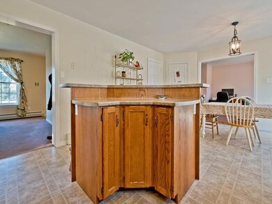Three bar stools can cozy up to this...