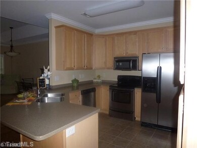 Kitchen. This highly functional Kitchen features lots of cabinets, corian counters and stainless appliances.