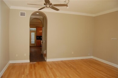 Entry/Living Room facing central stairway, half ba