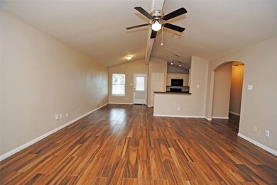 This spacious living area features warm wood like