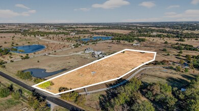Overview of rural landscape with property boundaries highlighted and a large body of water